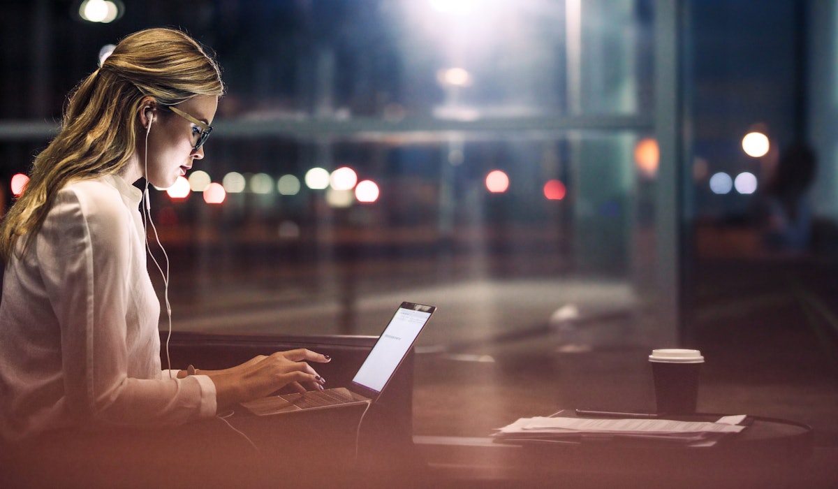Woman in coffee house laptop