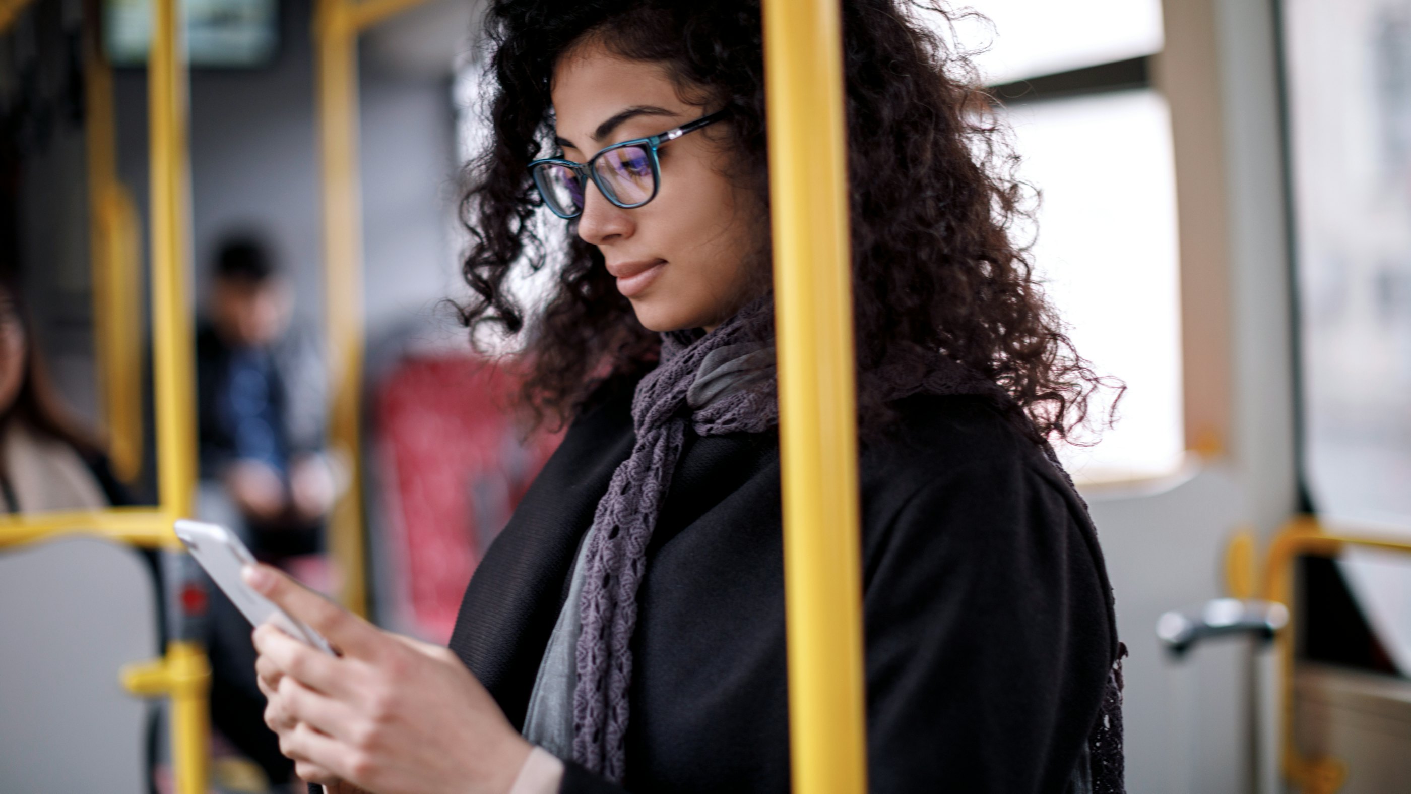 Woman riding bus smartphone