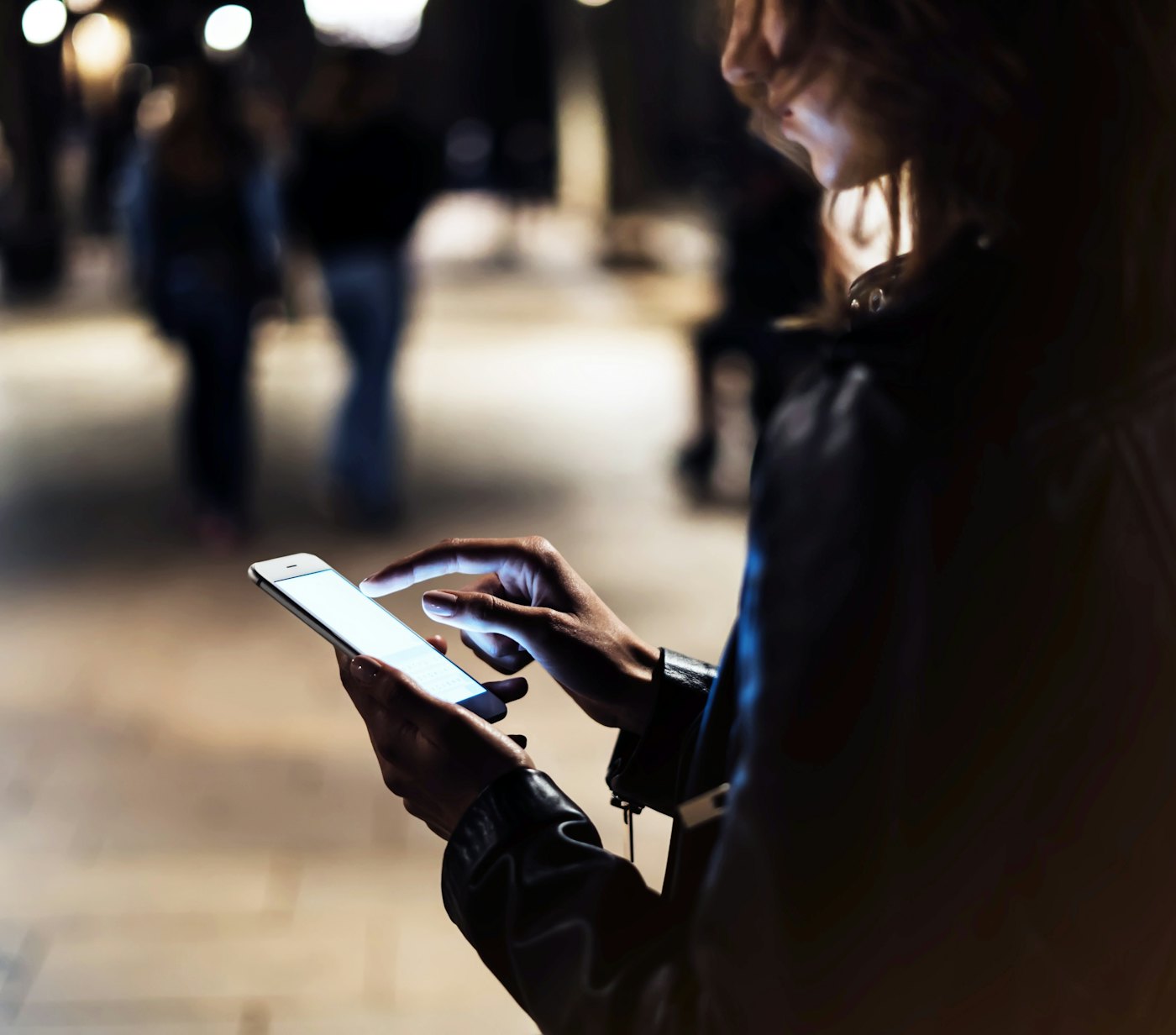 Woman smartphone at night