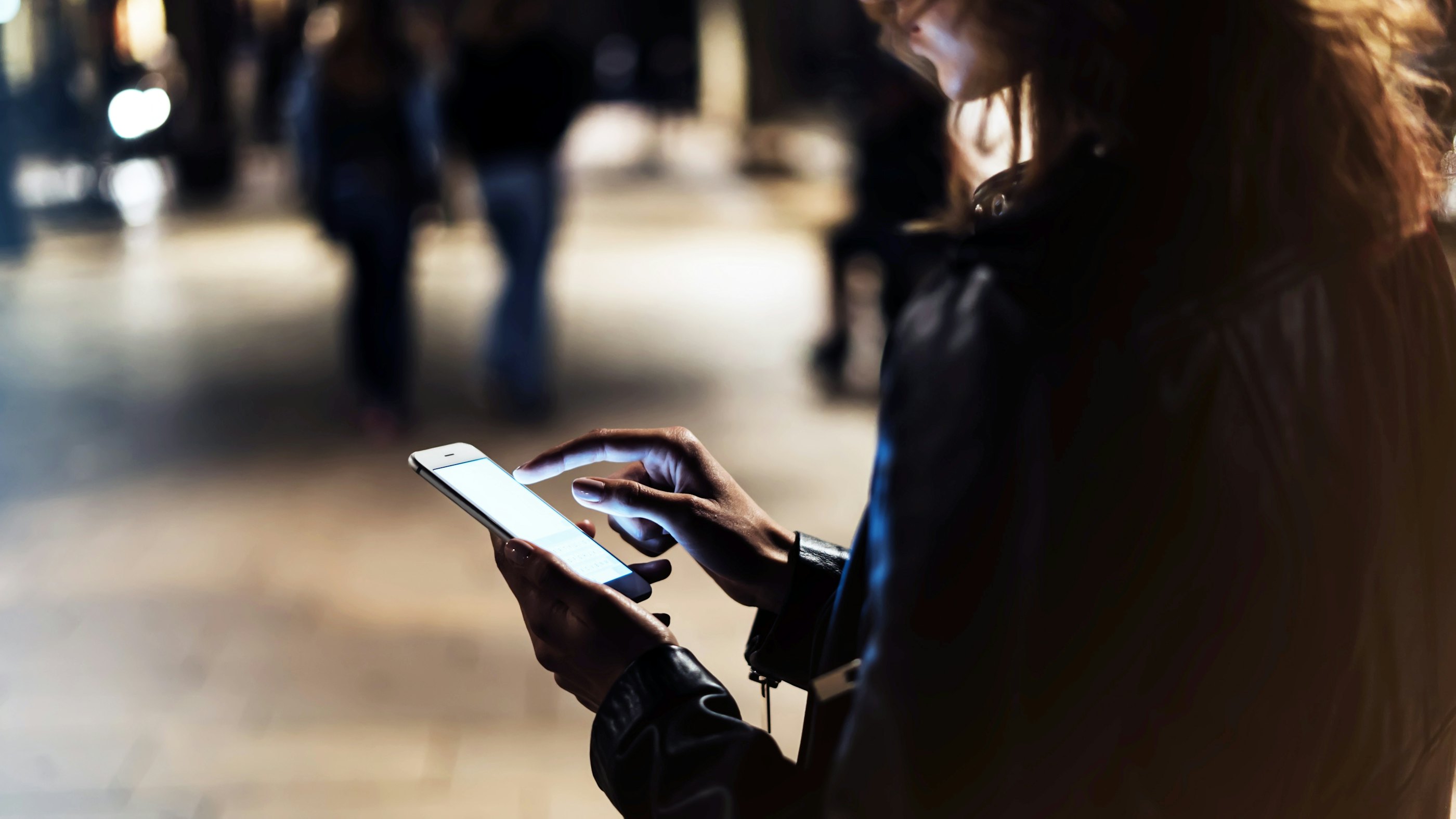 Woman smartphone at night