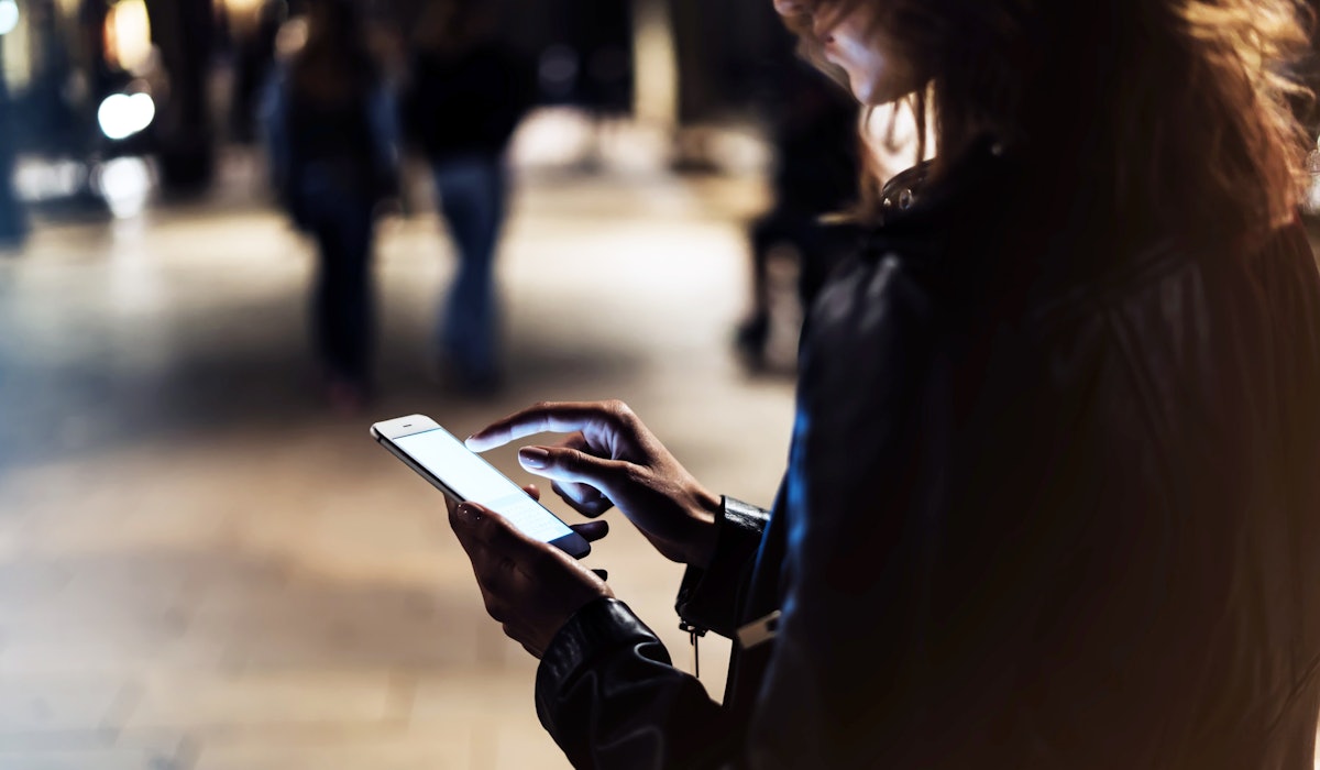 Woman smartphone at night