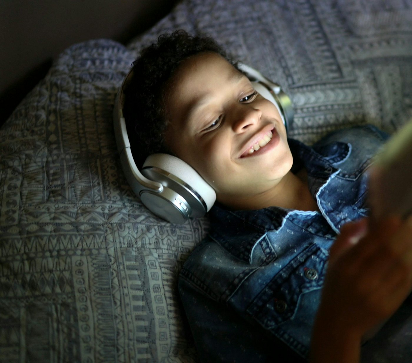 Boy watching tablet headphones