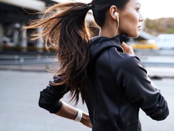 Young woman running smartphone