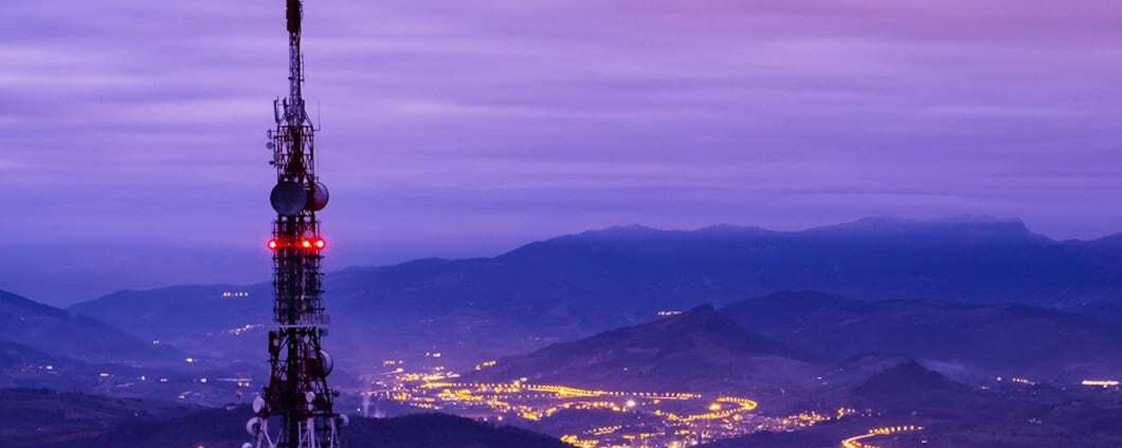 Comm tower town lights in valley avm 17463576e3